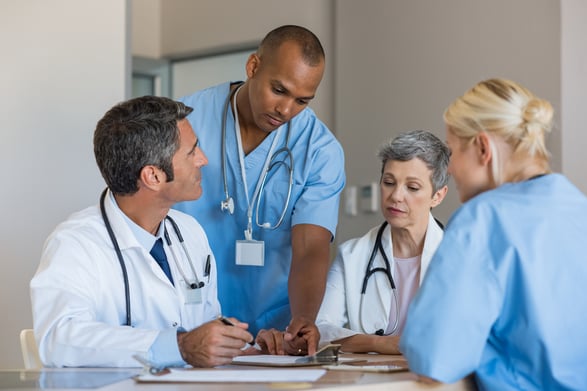 Doctors-in-a-meeting-667828930_1256x838